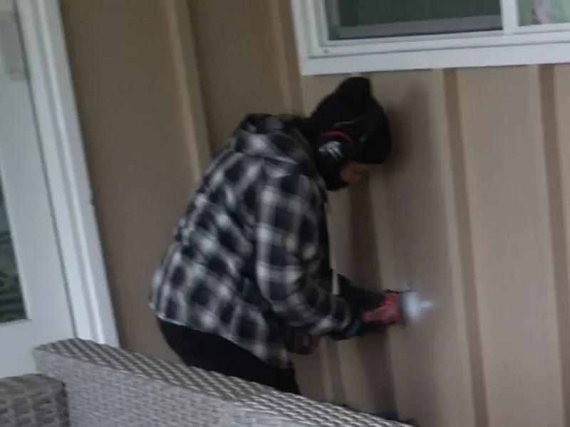 Professional electrician installing an exterior outlet in Crete